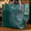 SoRetro Perfect FYG Leather Crossbody Tote – Marco Polo with Emerald Canyon on Copper Webbing – Silver Hardware
