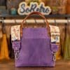 SoRetro Mini+ FYG Leather Crossbody Tote – Why Is My Pool Purple with Exclusivo Cala Saladeta on Lavender Cotton Webbing – Bronze Hardware