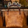 SoRetro Mini+ FYG Leather Crossbody Tote – Sandstorm with Exclusivo Mari Vines Navy on Cinnamon Cotton Webbing – Bronze Hardware