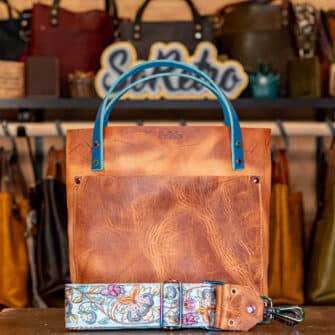 SoRetro Especial Mini+ FYG Leather Crossbody Tote – Furiosa Western Rogue with Exclusivo Prado de Primavera on Otsego Stripes Beige Webbing – Chromalusion Hardware