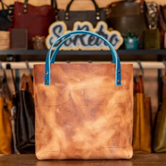 Alternative view of SoRetro Especial Mini+ FYG Leather Crossbody Tote – Furiosa Western Rogue with Exclusivo Prado de Primavera on Otsego Stripes Beige Webbing – Chromalusion Hardware