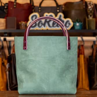 Alternative view of SoRetro Mini+ FYG Leather Crossbody Tote – Sycamore Springs with Exclusivo Granny's Bonnet Summer Sunset on Eggplant Webbing – Chromalusion Hardware