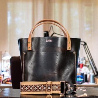 SoRetro Britannia Mini+ FYG Leather Crossbody Tote – Becontree with Exclusivo Rustleleaf Black on Dune Cotton Webbing – Shiny Gold Hardware