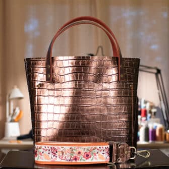 SoRetro Limited Verdura Perfect FYG Leather Crossbody Tote – Bronzegatore with Exclusivo Queen Annes Lace in Summer on Cinnamon Cotton Webbing – Bronze Hardware