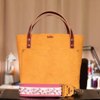 SoRetro Verdura Perfect FYG Leather Crossbody Tote – La Tela Turmeric with Exclusivo Sweet Camellia Blush on Mauve Cotton Webbing – Bronze Hardware