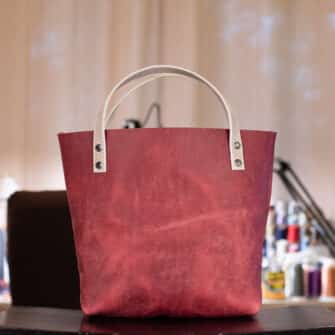 Alternative view of SoRetro Verdura Mini+ FYG Leather Crossbody Tote – Spuntino Guava with Serape Stripes Surprise on Dark Olive Cotton Webbing – Gunmetal Hardware