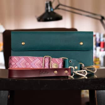 SoRetro Verdura FYG Crossbody Clutch - Cacciatore di Abisso with Exclusivo Penobscot Vineyard on Tropical Beach Blue Webbing - Bronze Hardware