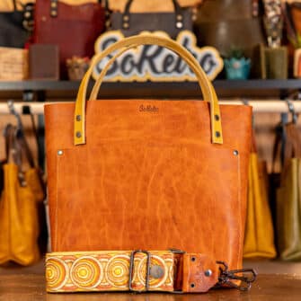 SoRetro Perfect FYG Leather Crossbody Tote – Orange Marmalade with Exclusivo Cosmic Pulse Sunrise on Sand Cotton Webbing – Gunmetal Hardware