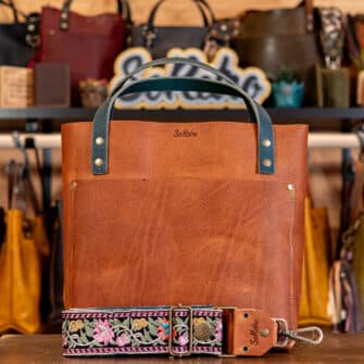 SoRetro Especial Perfect FYG Leather Crossbody Tote – Glowstone with Oaxaca Flowers Pink on Dark Teal Cotton Webbing – Bronze Hardware - Perfectly Imperfect