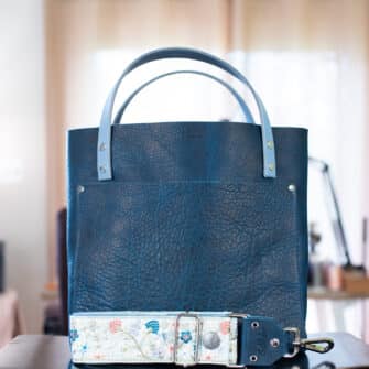SoRetro Perfect FYG Leather Crossbody Tote – Smash Abyss with Exclusivo Grove Park Gardens Periwinkle on Dusty Blue Cotton Webbing – Silver Hardware