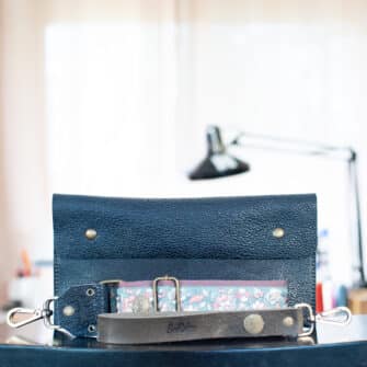 SoRetro Especial Reservo FYG Crossbody Clutch - Endangered Blue Tatanka with Exclusivo Pastel Belle Sky on Dusty Rose Cotton Webbing - Bronze Hardware