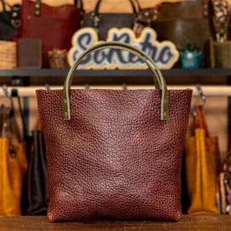 Alternative view of SoRetro Mini+ FYG Leather Crossbody Tote – Novarupta with Sierra Cotta with Exclusivo Little House on the Prairie by the Sea on Sienna Cotton Webbing – Bronze Hardware