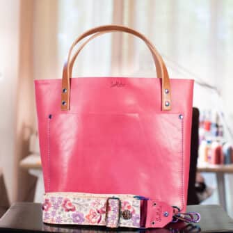 SoRetro Perfect FYG Leather Crossbody Tote – Bougie Berry with Exclusivo Cala Primavera on Simply SoRetro Sandstone Webbing – Chromalusion Hardware
