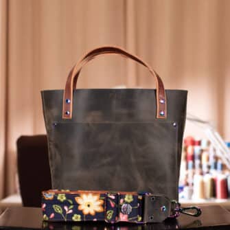 SoRetro Mini+ FYG Leather Crossbody Tote – Above Average Sage Energy with Heritage Delilah Gardens on Sienna Cotton Webbing – Chromalusion Hardware